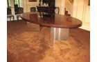 Dunbar Dining or Conference Table Mid to late 70s Designed by Roger Lee Sprunger, a protege of Edward Wormley An iconic piece wth high mirrored pristine finish of Brazilian Rosewood with Mahogany banned edges.  Polished Chrome Planks â€“ Plinths V shaped bases and middle secret drawer with Brass Dunbar tag.  Oval in shape and measuring 110 in. x 60 in.     - Extraordinary Auction - Nike Spillson Home Interiors & Furnishings